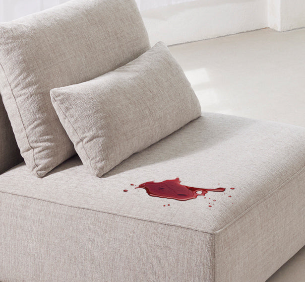 Wie entferne ich einen Rotweinfleck von meinem Sofa?